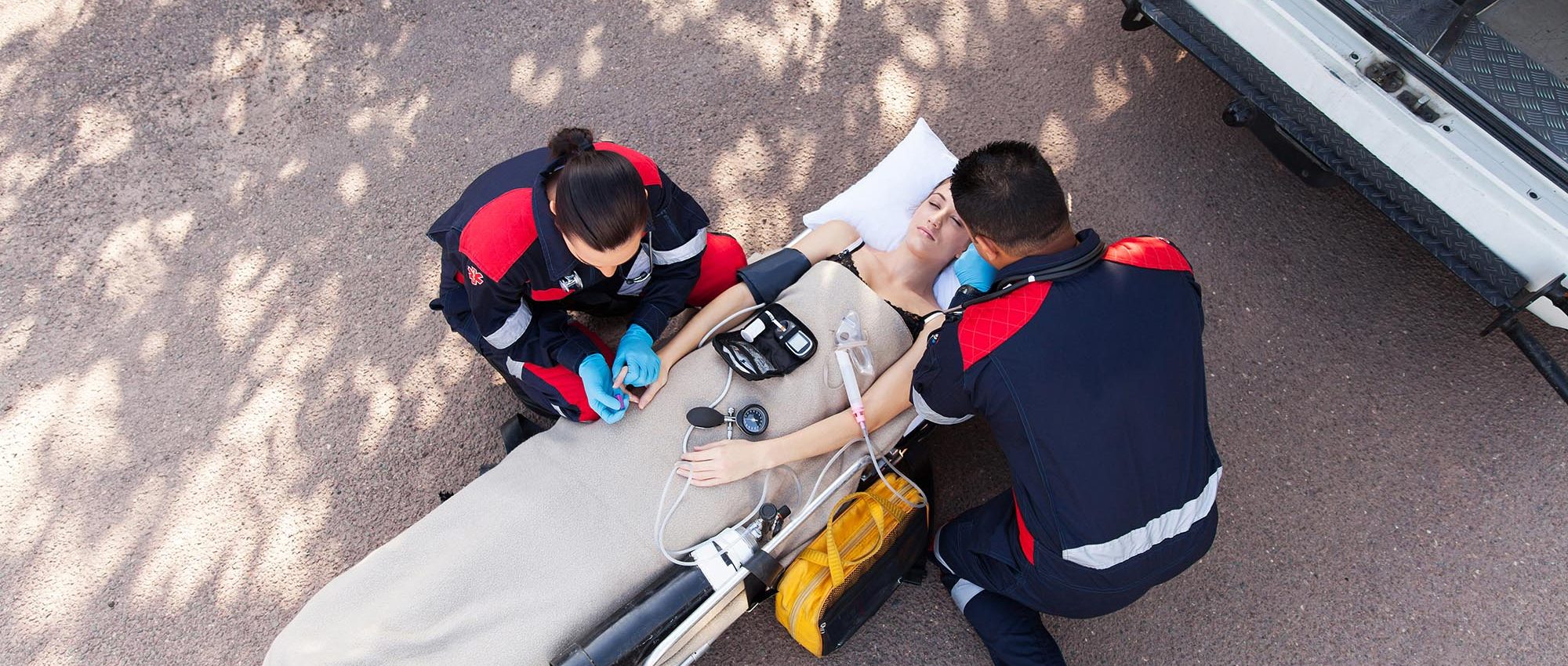 EMTs working on a female patient