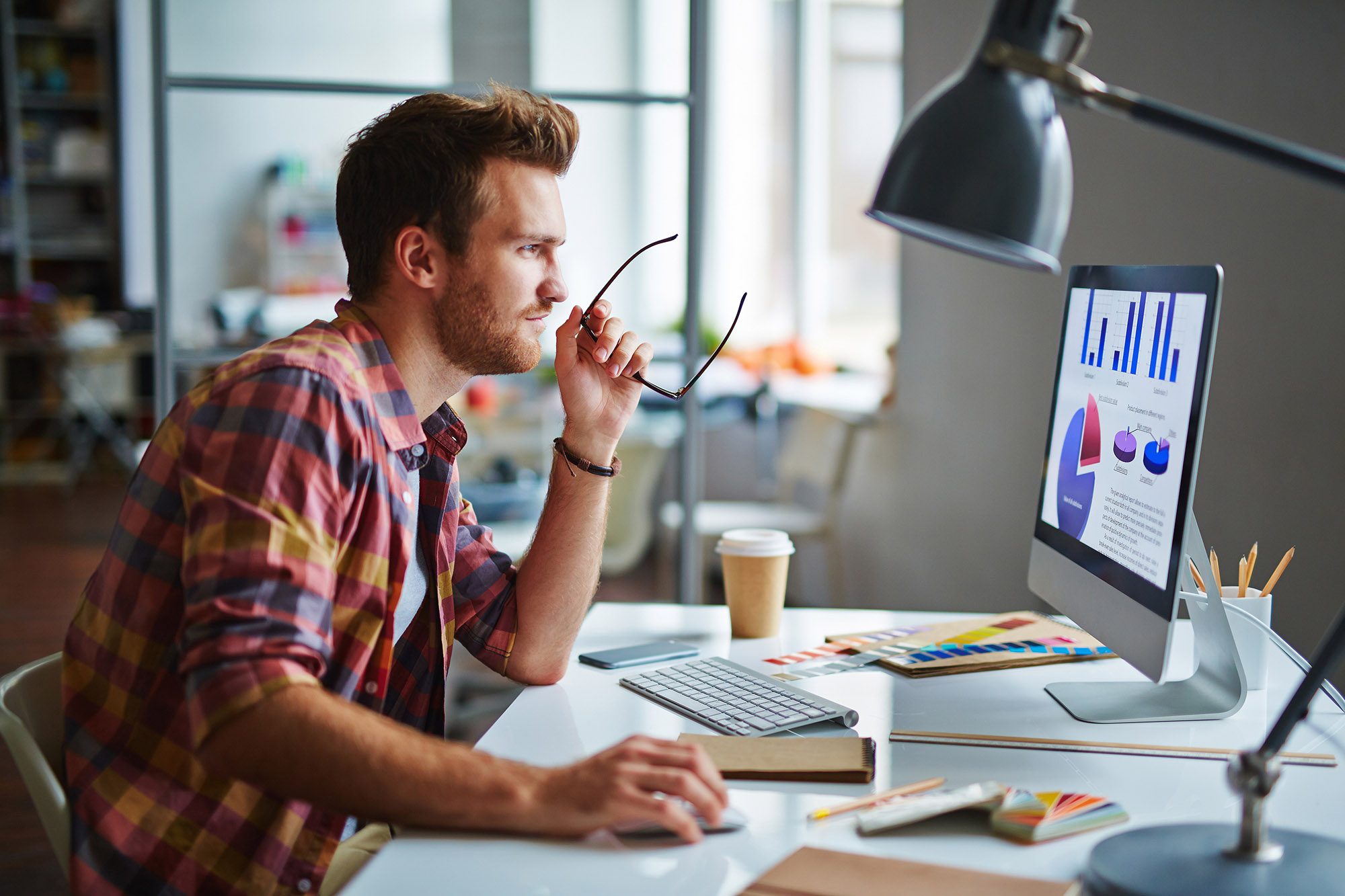 man sitting at his computer working