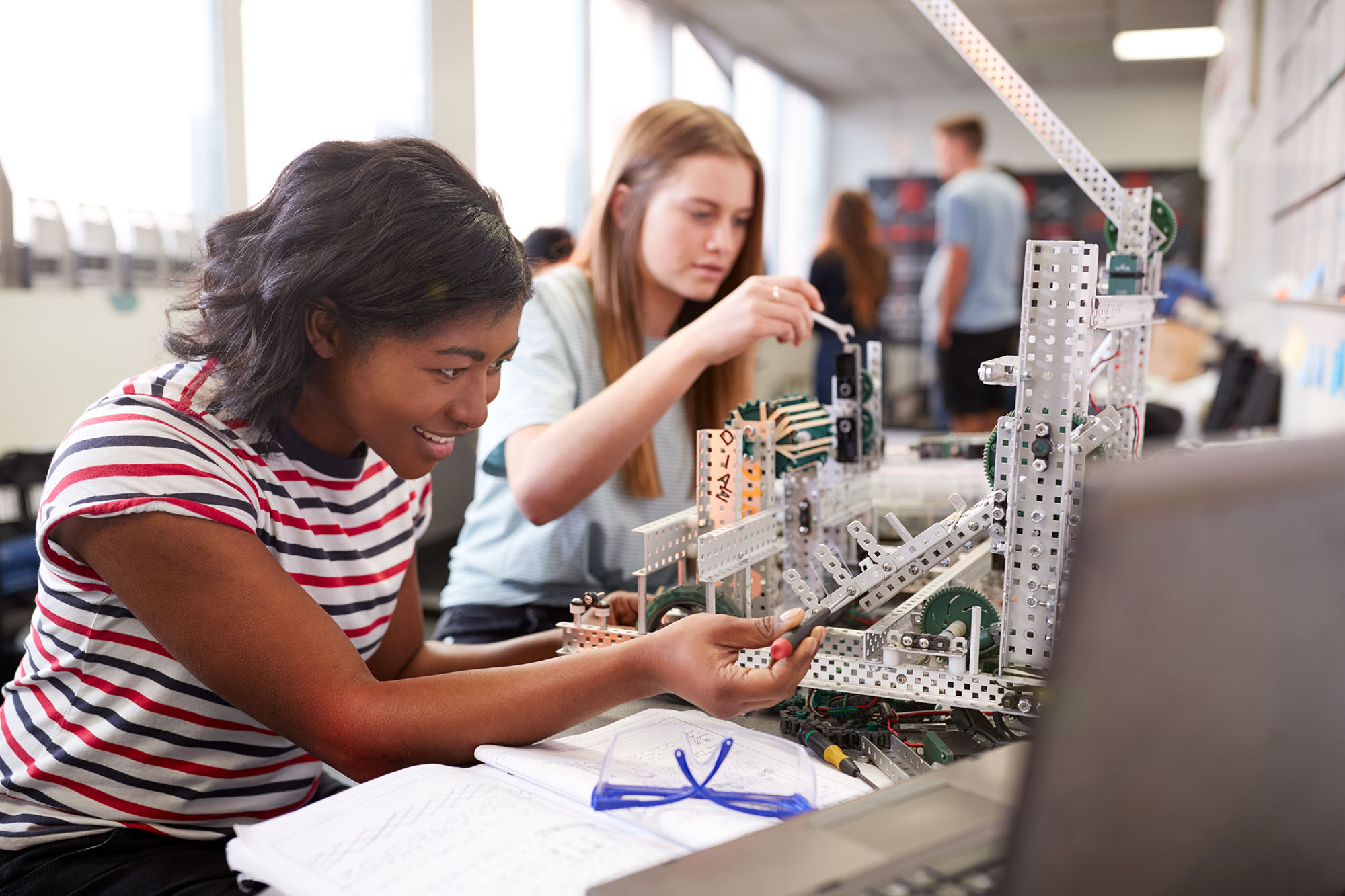 teen girls building in their pre-engineering class