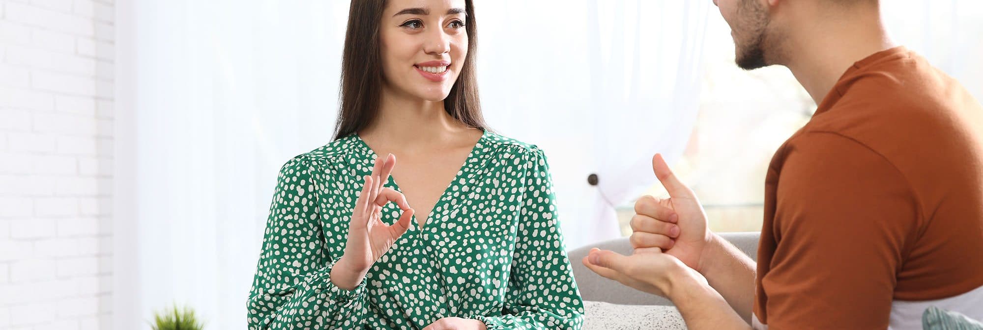 two people talking with sign language