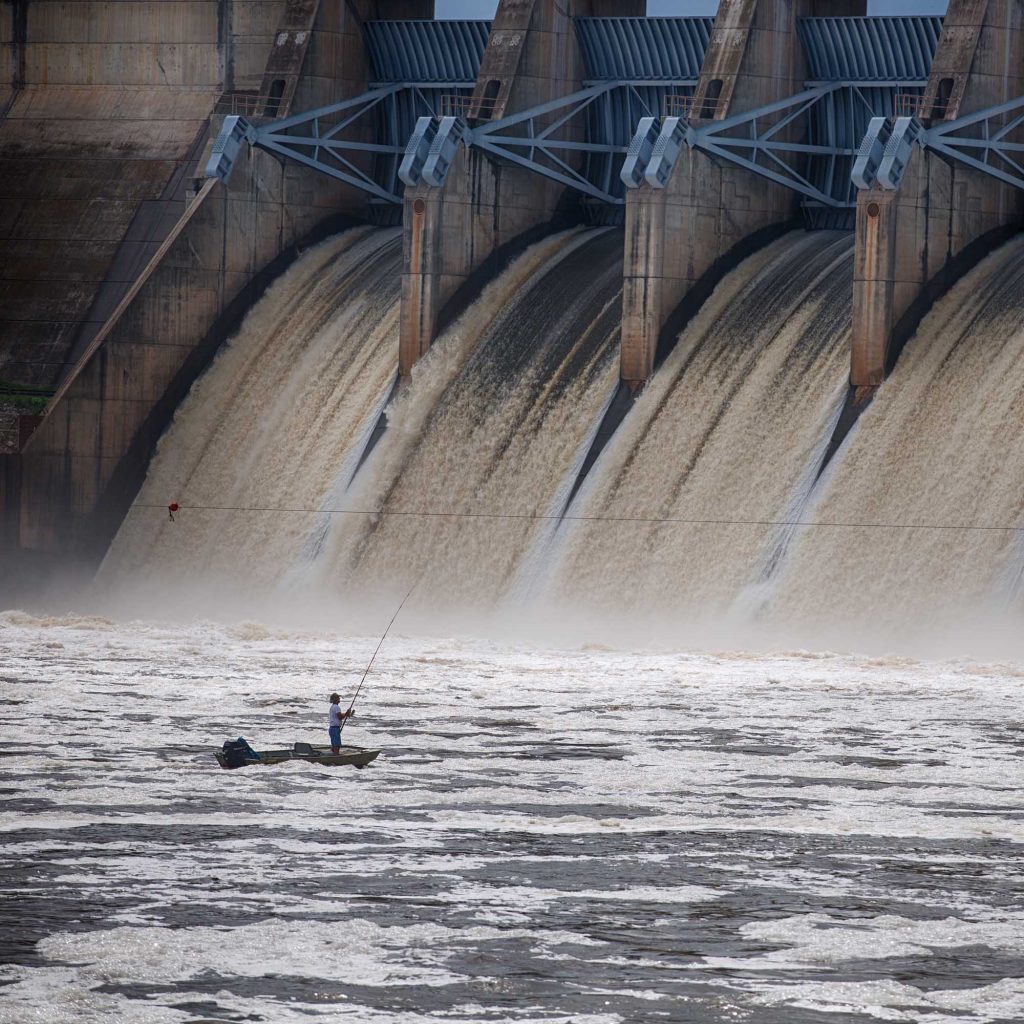 photo of a man fishing by the Keystone Dam in Mannford Oklahoma