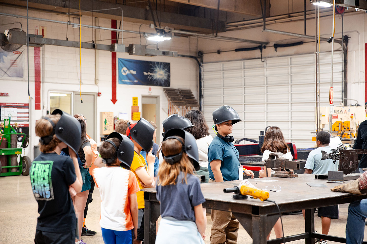 After designing letters in Computer-Aided Drafting software, Central Tech Camp Explorer students watched as the CNC plasma table cut their designs.