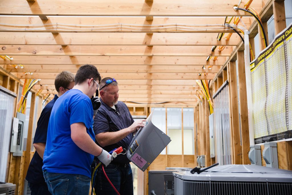 Central Tech HVAC teacher showing students how to work on a unit