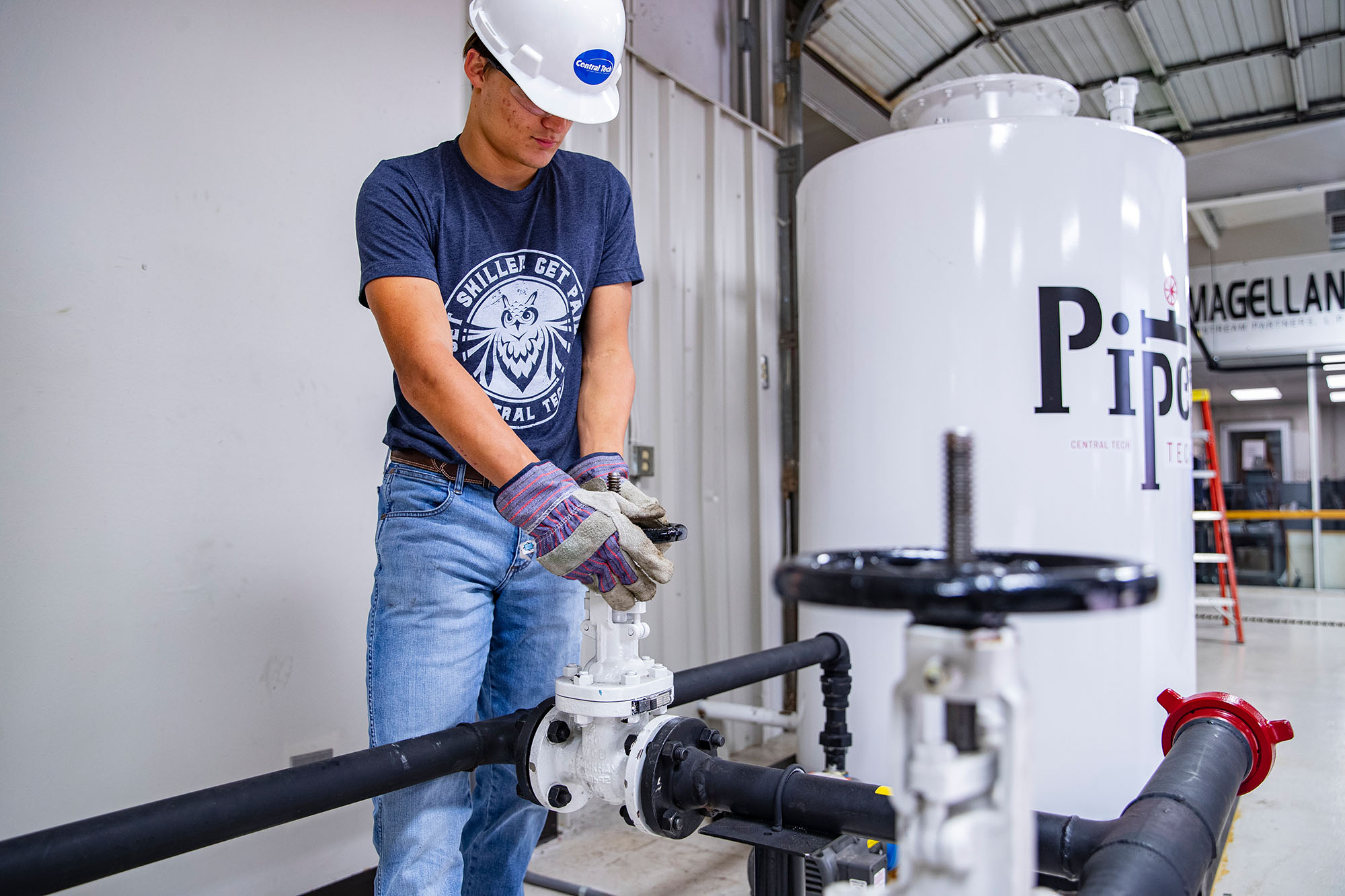 Pipeline student checking a valve at Central Tech in Drumright