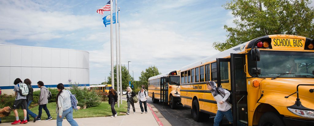 Students getting off the bus at Central Tech in Drumright