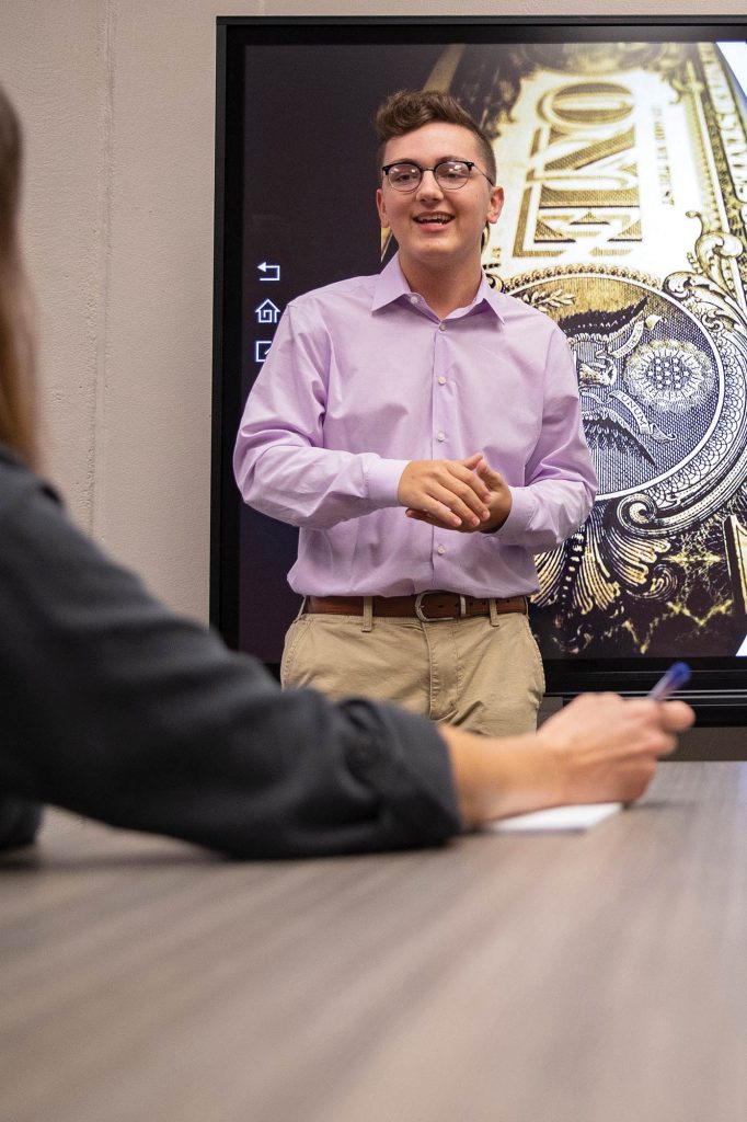 business student making a presentation