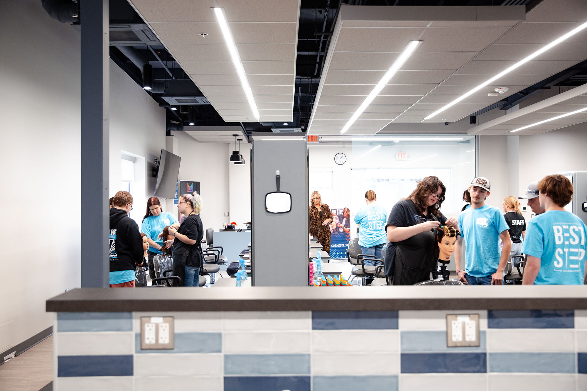 Divided into groups, students visited different stations in the cosmetology lab.