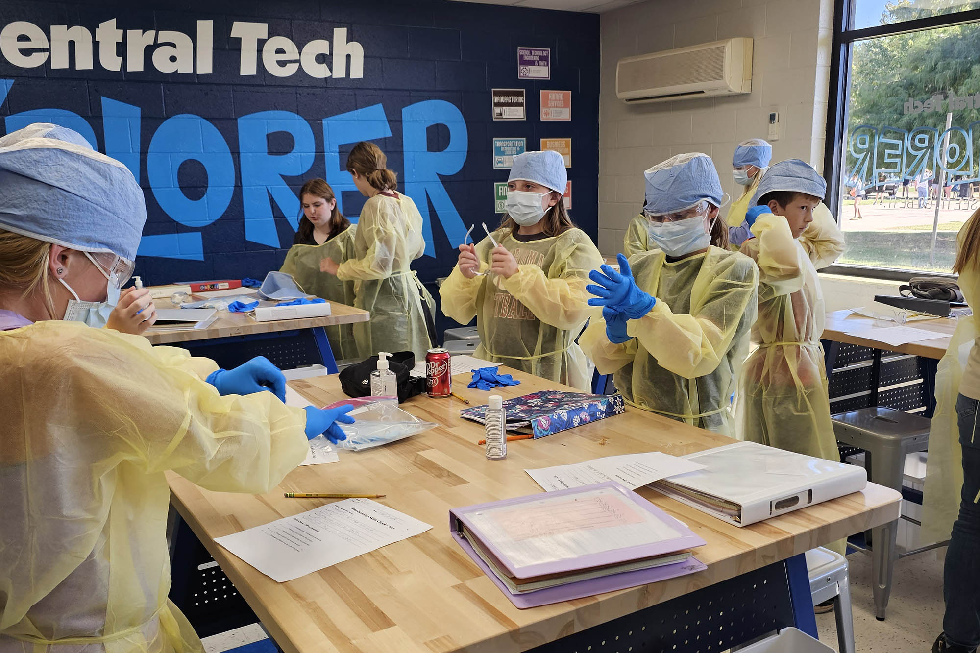 Explorer students put on healthcare PPE