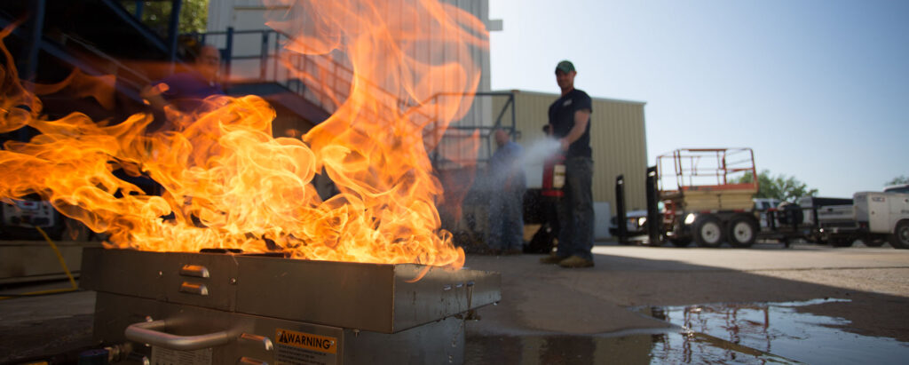 firefighter putting out training fire