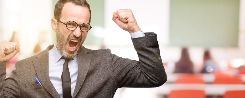 happy teacher in classroom