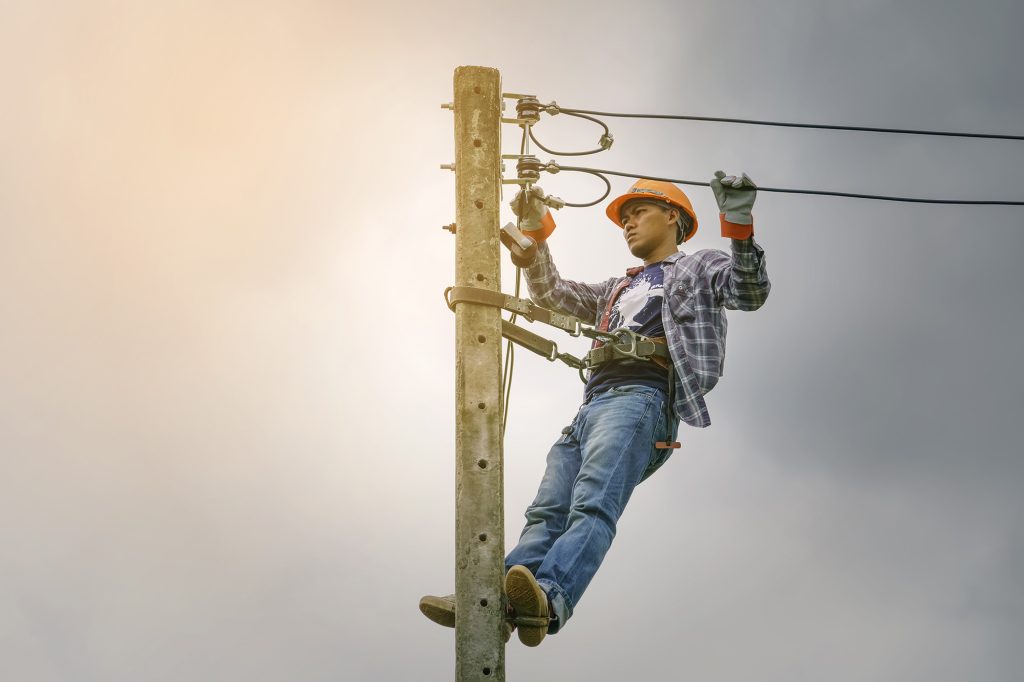 lineman fixing electrical lines