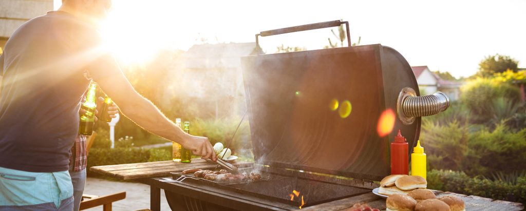 man grilling outside