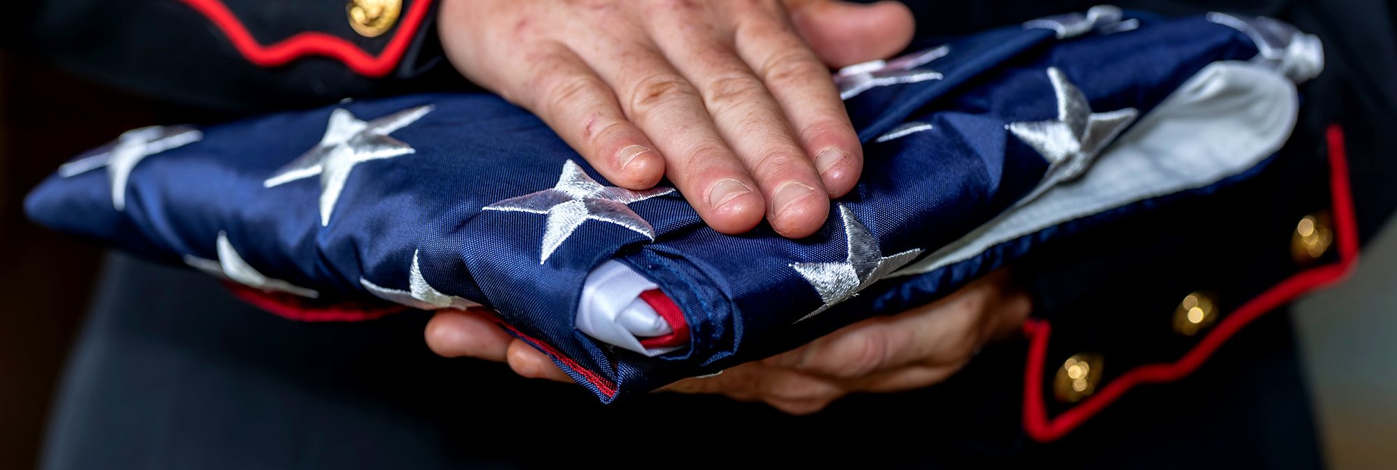 person holding folded flag