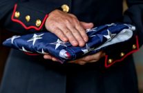 person holding folded flag