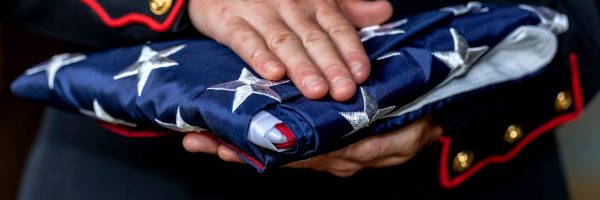 person holding folded flag