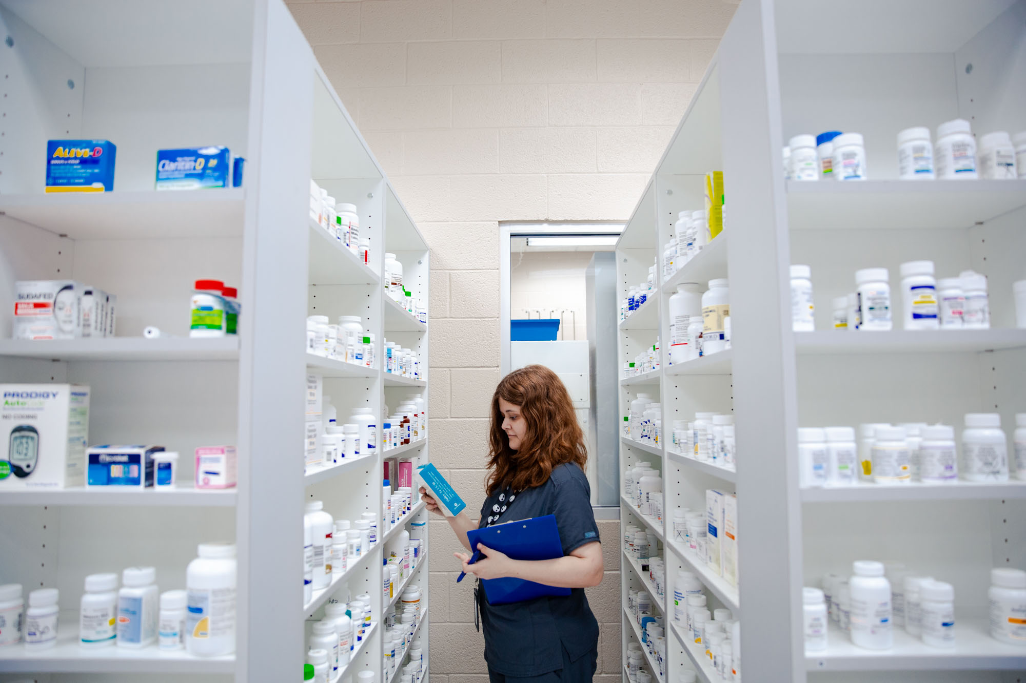 pharmacy technician student at Central Tech in Sapulpa looking at medication bottles