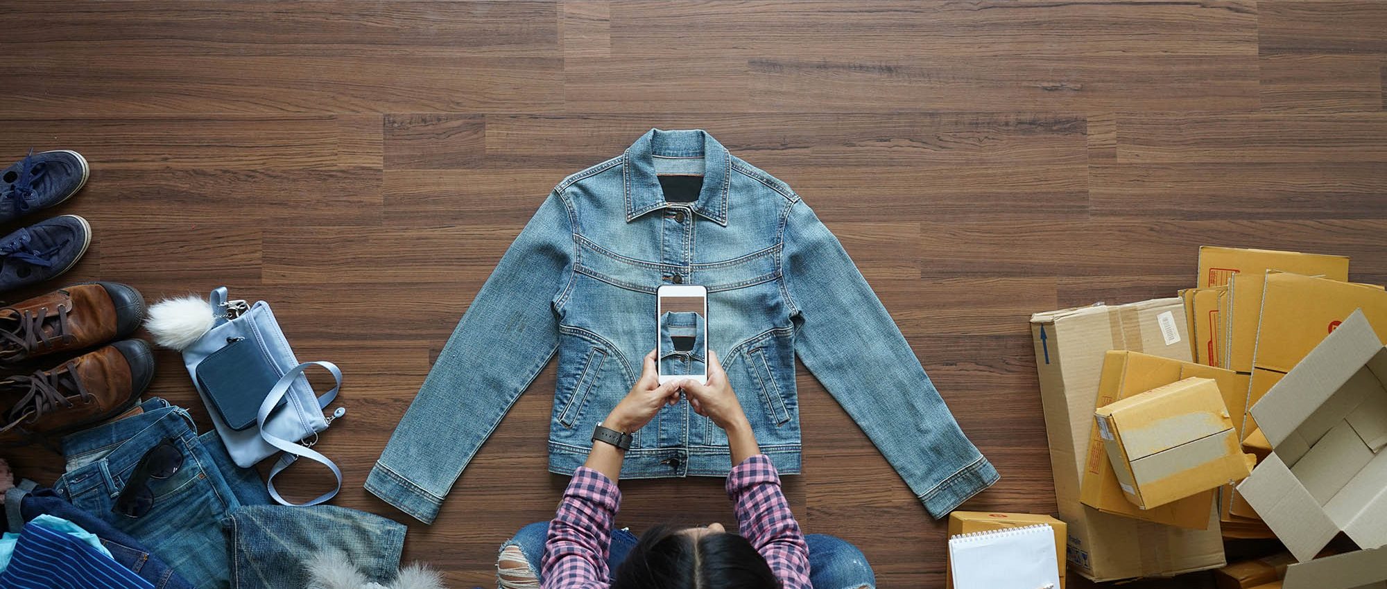 photo of a woman taking a picture of her products to sell