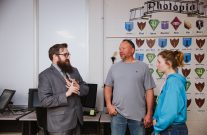 photography teacher talking to a parent and student