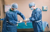 surgical technologist students at Central Tech gloving up