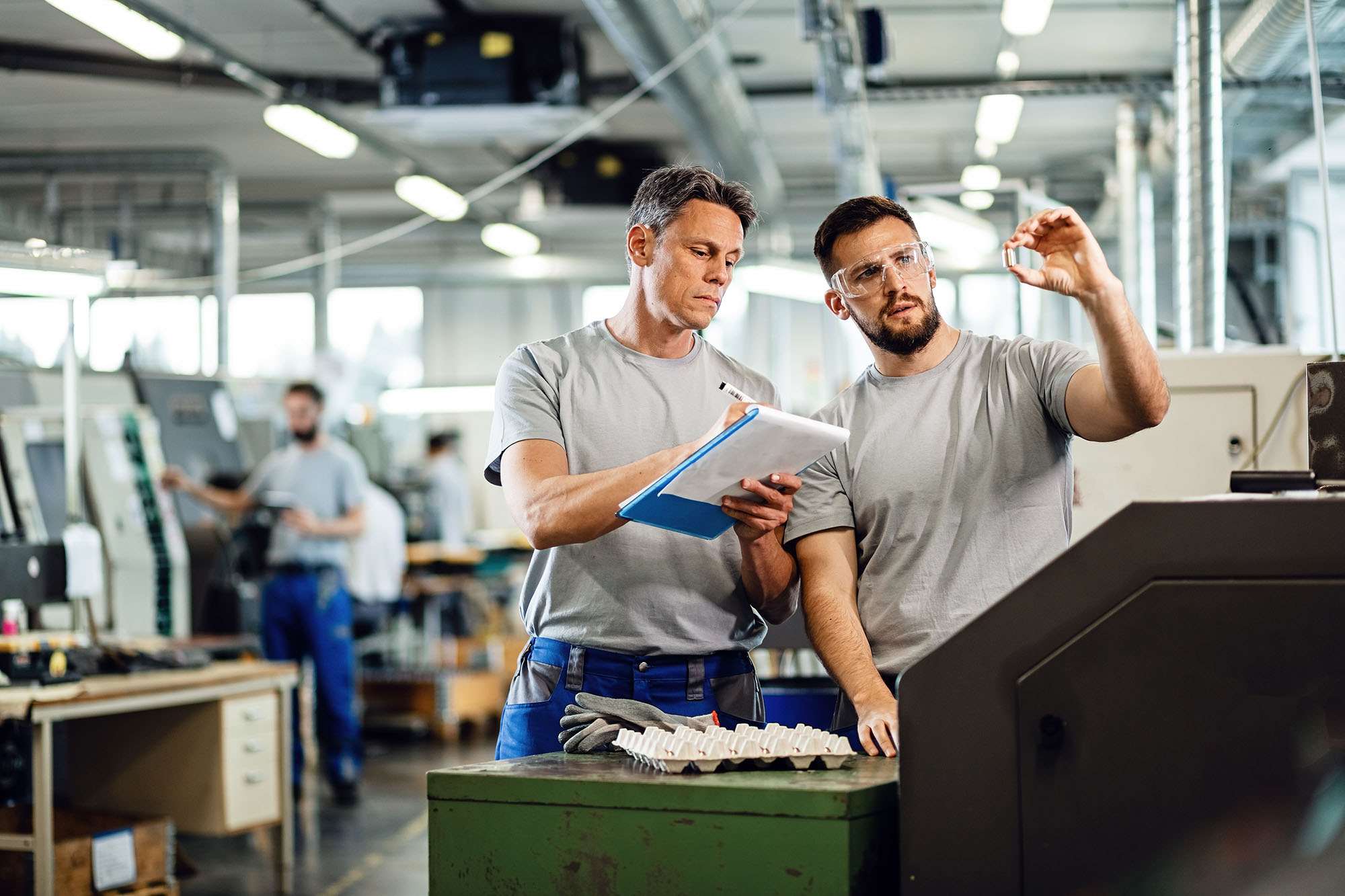 two-men-talking-on-a-manufacturing-floor-1