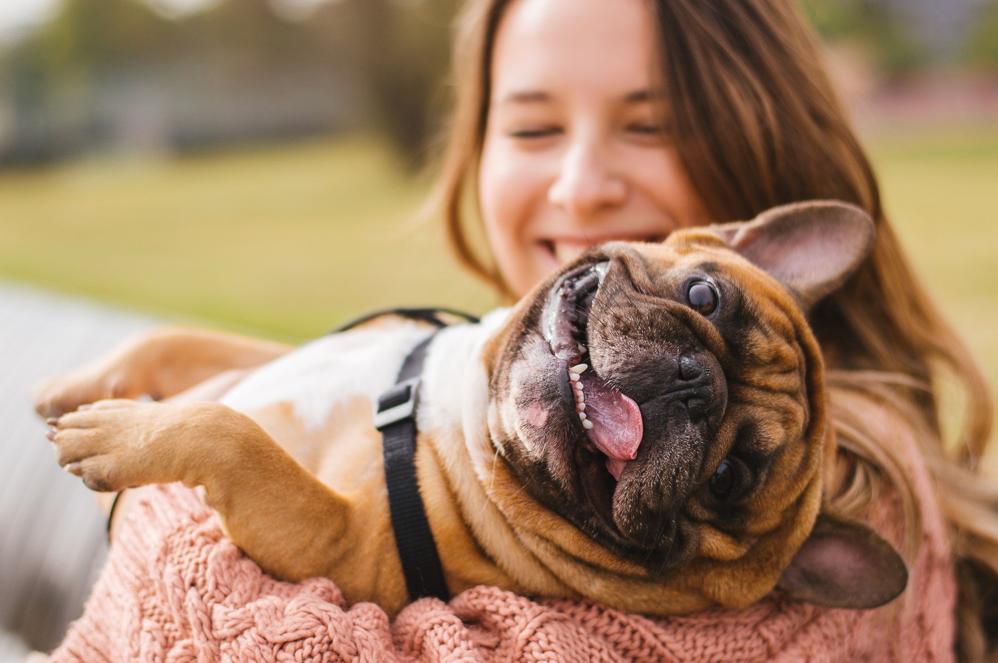 woman holding her dog