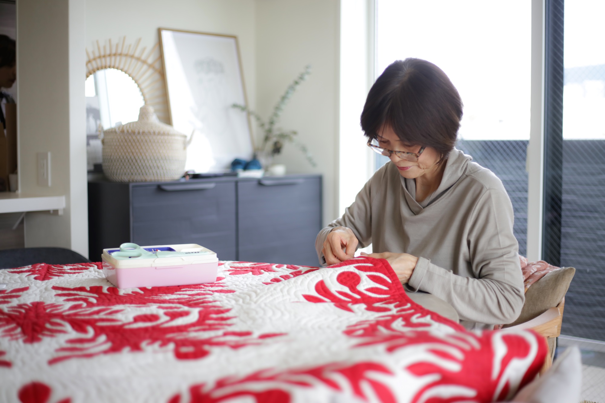 woman quilting by hand